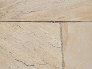 Close-up van beige zandsteen Gele munt