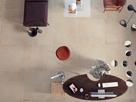 Woonkamer met betonlook tegels van Pure Sand