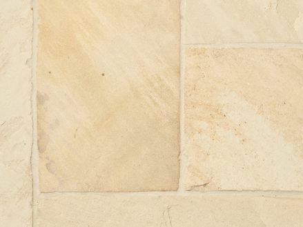 Close-up van platen gele muntzandsteen van bovenaf